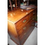 An Edwardian mahogany chest of two short and three long graduated drawers, on block base, 41" wide x