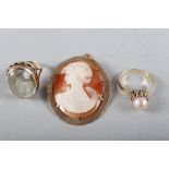A cameo brooch in 9ct gold mount, a pearl set dress ring and a 9ct gold dress ring set topaz