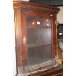 An early 20th century mahogany corner hanging cabinet enclosed glazed panel door, 28 1/2" wide x 14"