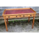 A late 19th century mahogany tray top writing desk with tooled lined top, fitted two drawers, on