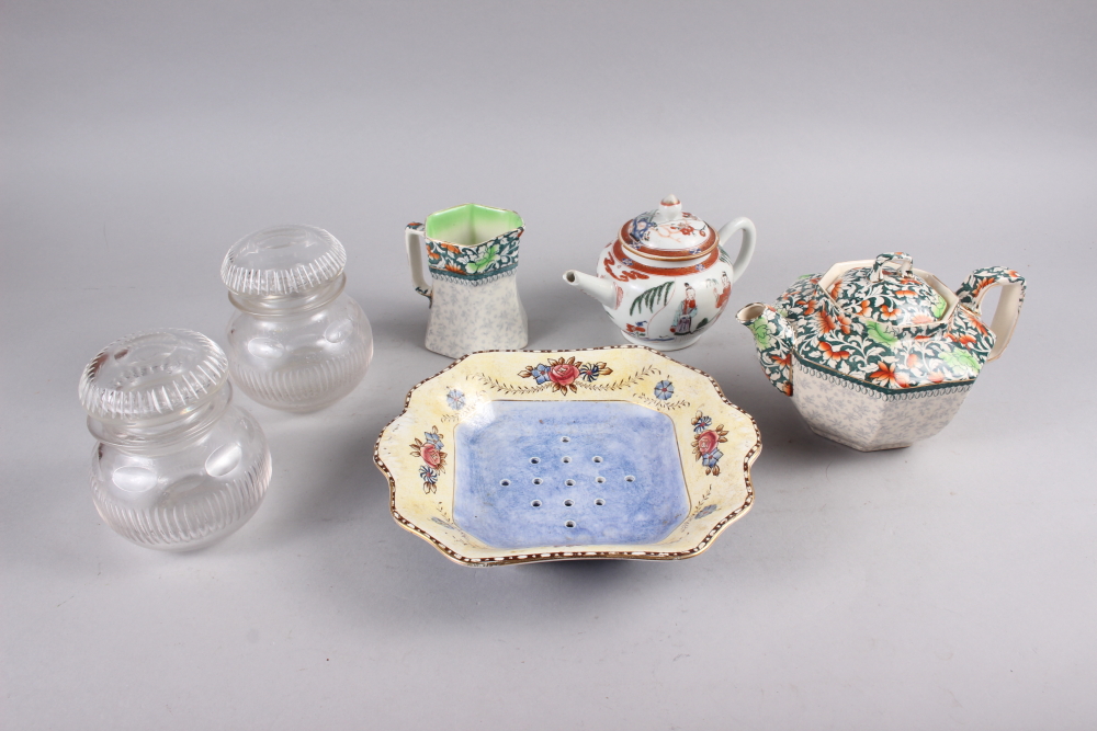 A Royal Doulton floral decorated teapot and matching milk jug, a cress dish, a pair of cut glass