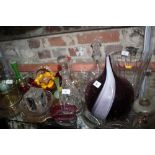 A Villeroy and Boch ice bucket, 9" high, and an assortment of cranberry glass, decanters, coloured