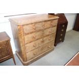 A Victorian figured walnut chest of two short and three long drawers with turned knob handles, on