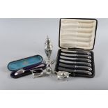 A silver mustard three piece cruet, a cased spoon, 4.8oz troy approx, a weighted silver sugar shaker