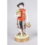 A pair of Continental figures, flower sellers, 7 1/2" high, a Vienna figure group of a man, woman