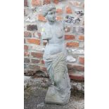 A cast stone figure of Venus de Milo, 34" high (cracked neck), a composition bust of Apollo