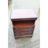 A mahogany bedside cabinet, fitted recess over three drawers, 18" wide x 12 1/2" deep x 25 1/2" high