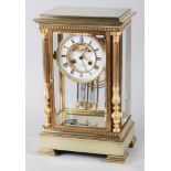 A late 19th century French four-glass mantel clock with eight-day crystal regulator striking