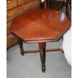 An Edwardian walnut octagonal table, on turned and stretchered supports, supplied by Bowman Bros