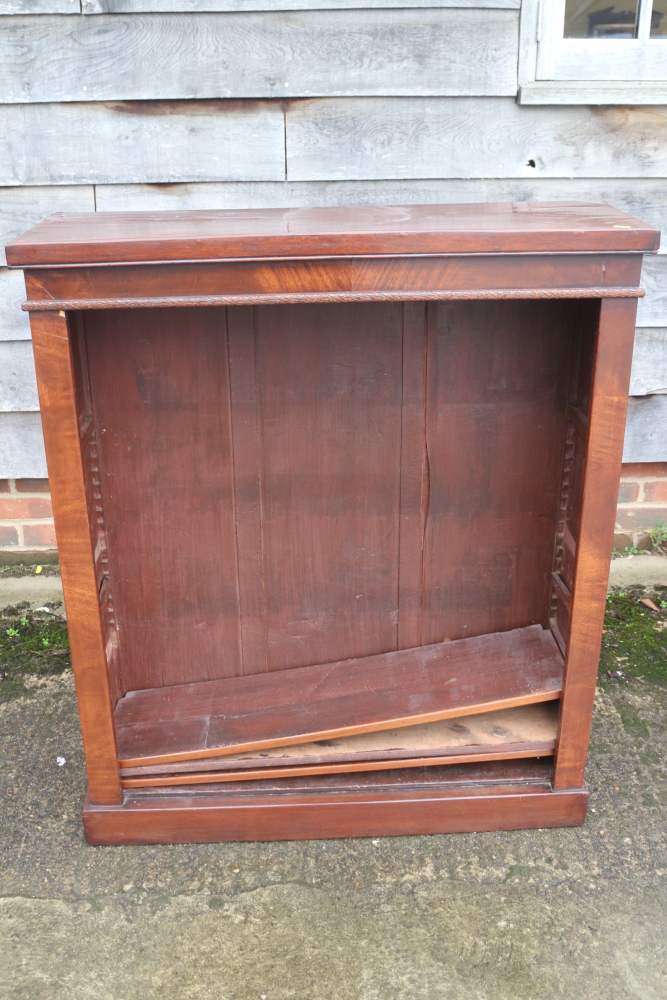 A mahogany open bookcase, fitted adjustable shelves, on block base, 36" wide x 12" deep x 42" high