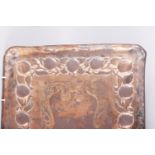 A Newlyn copper tray with embossed decoration, 23" wide, a copper coal scuttle, a copper kettle,
