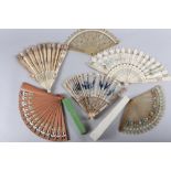 A late 19th century ivory fan with bluebird sequinwork design, and five other fans