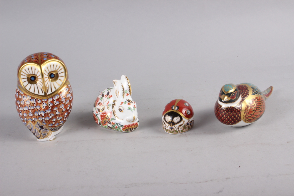 A Royal Crown Derby owl paperweight with gold stopper, 4 1/2" high, and three other similar Royal