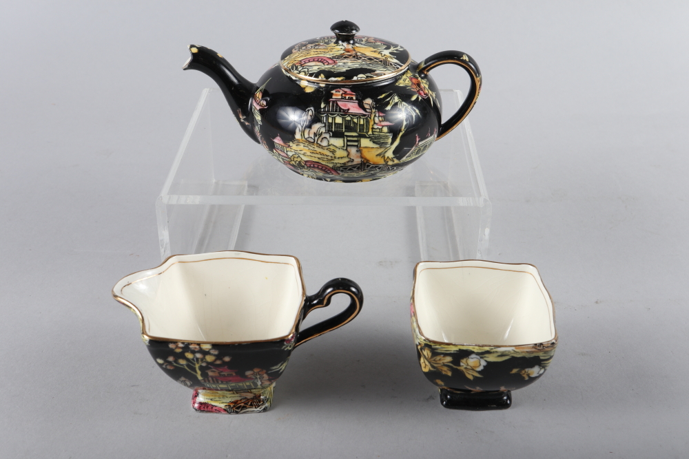 A bachelor's Royal Winton Grimwades teapot with matching milk jug and sugar bowl with chinoiserie