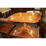 A 19th century Italian walnut octagonal parquetry top low occasional table, on turned column and