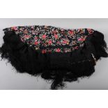 A Chinese embroidered black silk piano cloth with deep fringe