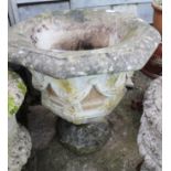 An octagonal pedestal planter, decorated swags, 23" high