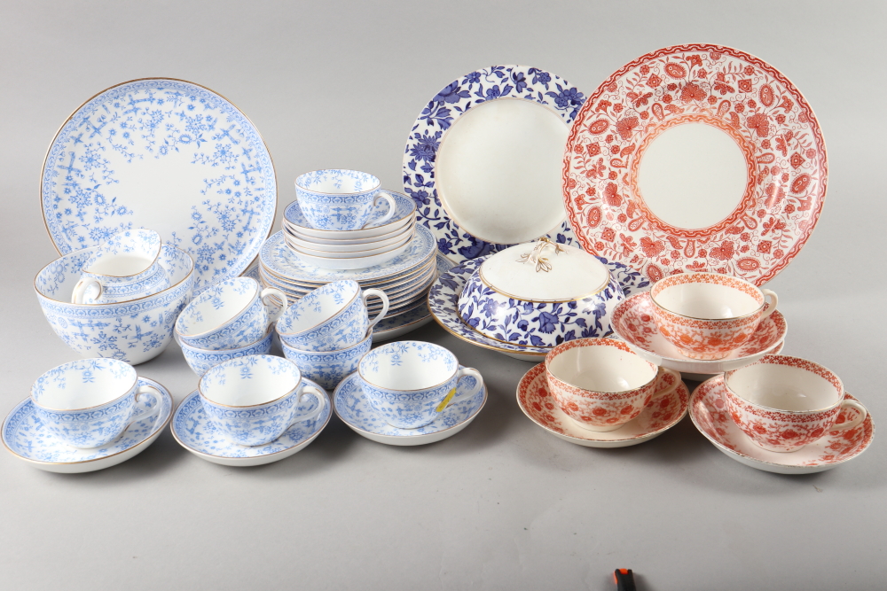 A Derby porcelain "Osborne" pattern part teaset, a part teaset with plate and a Minton muffin