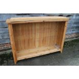 A pine open bookcase, fitted adjustable shelves, 62" wide x 16" deep x 43" high