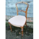 A 19th century grained as rosewood bar back carver chair with drop-in seat, a pair of Victorian