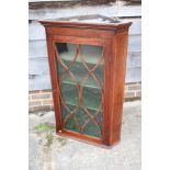 A 19th century mahogany and box line inlaid corner hanging cabinet enclosed lattice glazed door, 29"