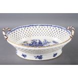 A Worcester porcelain chestnut basket with swag decorated border and crescent mark to base, 13" wide