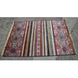 A multi-coloured Kashmir carpet with all-over traditional design, 67" x 46" approx