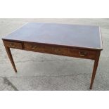 A late 19th century oak and mahogany rectangular library table with inset leather top over one