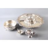 A silver plated pedestal hors d'oeuvres dish with central cover, a plated sugar chute and other