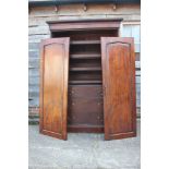 A Victorian mahogany wardrobe, the interior fitted slides over two short drawers and two long