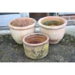 A pair of bulbous terracotta plant pots, 13 3/4" dia x 11 1/2" high, and a another similar