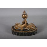 A mid 19th century Continental bronze and marble oval desk weight, formed as two dolphins, 5 3/4"