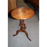 Two polished as mahogany circular topped wine tables, on turned columns and tripod splay supports,