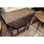 An Edwardian walnut octagonal table, on turned and stretchered supports, supplied by Bowman Bros