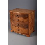 A burr walnut miniature bowfront chest of four long graduated drawers, on bracket supports, 9 1/2"