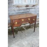 An early 19th century mahogany, banded and ebony line inlaid bowfront sideboard, fitted one