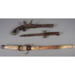 A Japanese Tanto sword with scabbard, 23" long overall, a reproduction flintlock pistol and a WWI