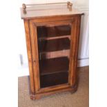 An early 20th century figured walnut and inlaid music cabinet enclosed glazed panel door, on bracket