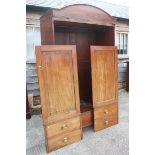 A Victorian mahogany and ebony line inlaid wardrobe with arch top pediment