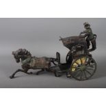 A painted die-cast model of a hansom cab
