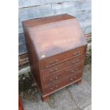A mahogany and banded fall front bureau with fitted interior over four long drawers, on bracket