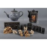 Eight resin figures, in erotic poses (largest 2 3/4" high), a black metal five-sided teapot with