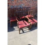 A Harlequin set of five 19th century mahogany splat back dining chairs with drop-in seats, on