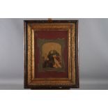 A pair of 19th century coloured photographs of a man and a woman, in deep gilt and wooden frames,