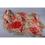 A 19th century printed paisley type shawl, 52" square approx, and a fez with white metal wire tassel