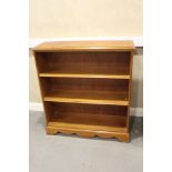A yew and banded open bookcase, on block base, 37 1/2" wide x 12" deep x 41" high