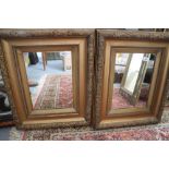 A pair of ornate deep gilt framed mirrors, 13 3/4" x 9 1/2"