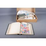 An Ajax stamp album, containing stamps from around the world, a box, containing a quantity of