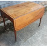 An early 19th century mahogany and ebony strung Pembroke table, fitted one drawer, on slender turned