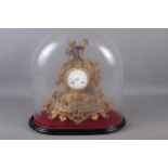 A 19th century gilt spelter mantel clock with hunter surmount, 14" high, under a glass dome shade,